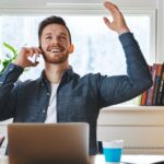 US expat throws his hands up in relief as he discusses his US tax filing options from abroad with his US expat tax expert.