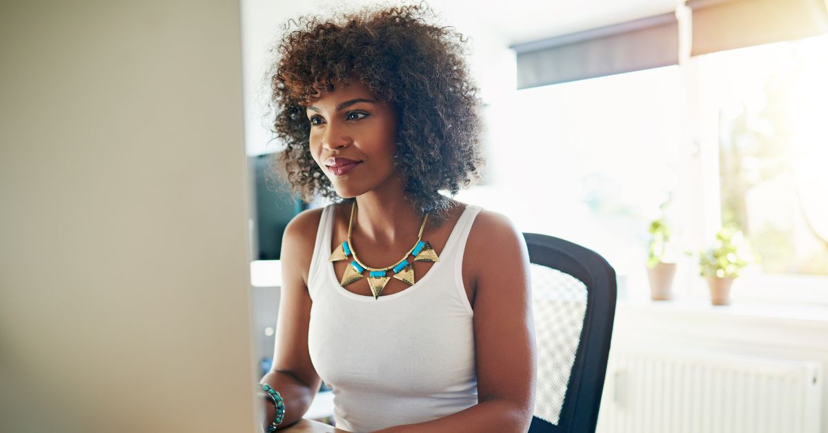 US taxpayer living abroad researches how to repay her student loans overseas on a computer.