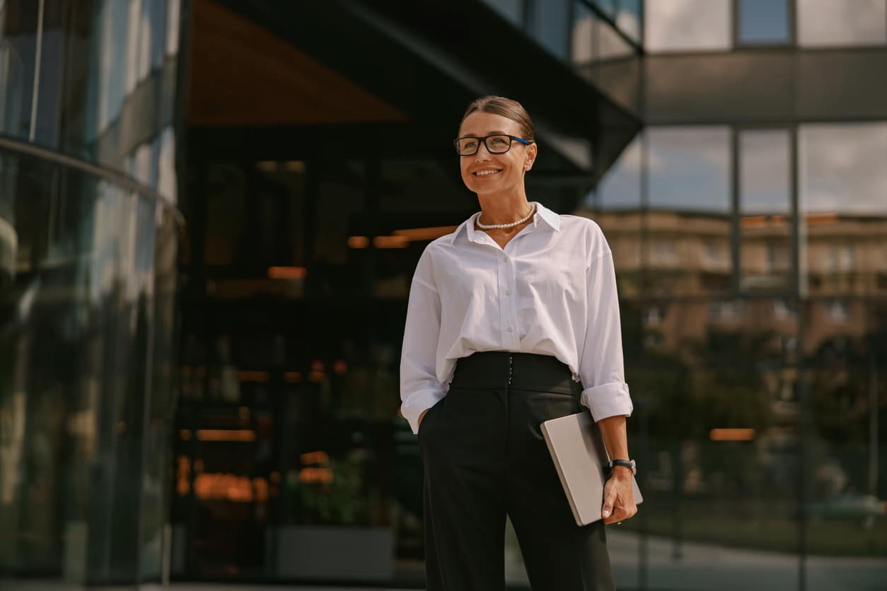 Confident businesswoman working internationally, potentially qualifying to exclude income using Form 2555.