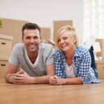 Happy homeowners celebrating a new house, reflecting the lifestyle appeal often associated with a golden visa.