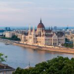 Waterside architecture in Budapest highlights the classic charm enjoyed by Americans living in Hungary.