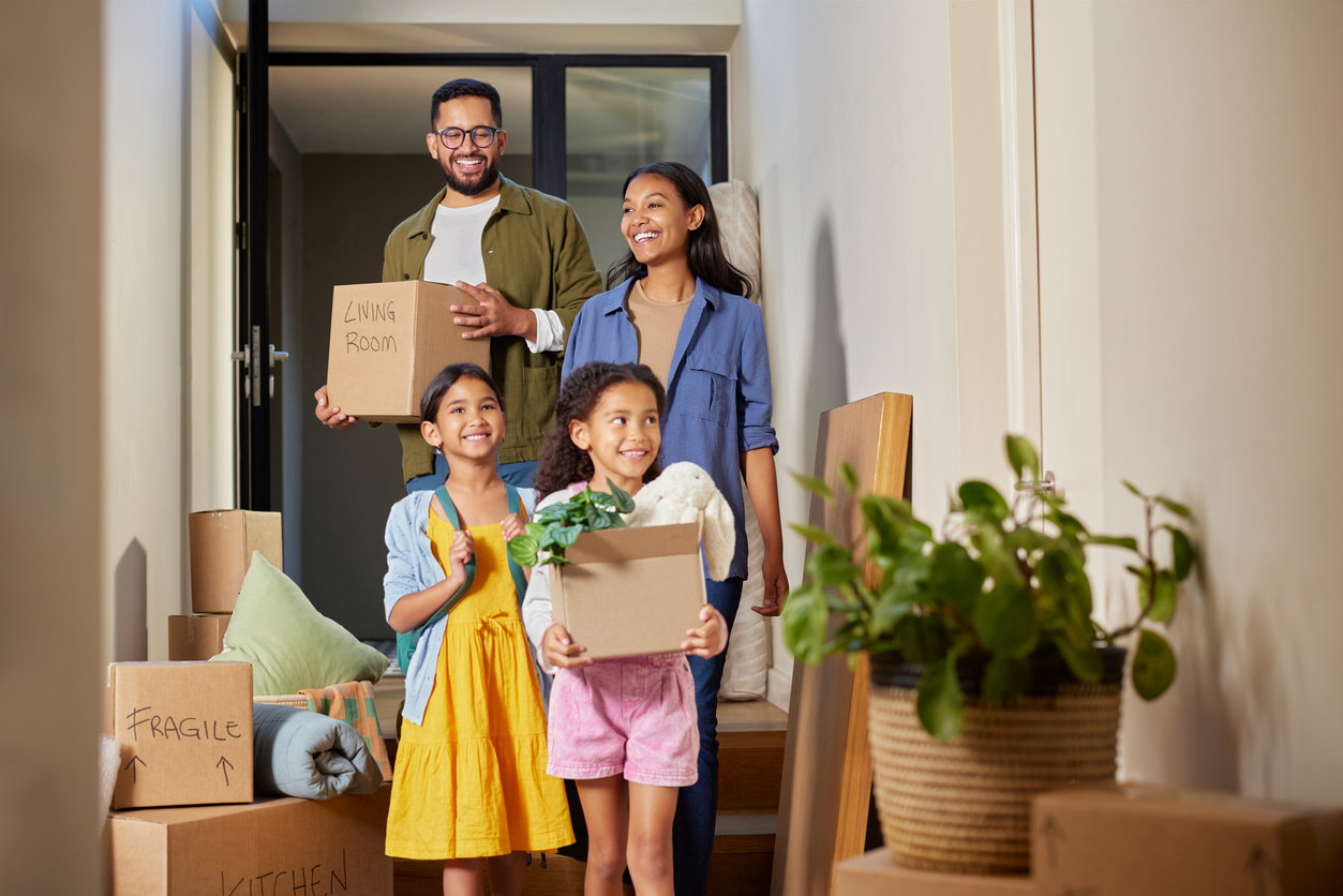 Family moving into their new Canadian home, navigating life changes after a US to Canada conversion of savings and income.